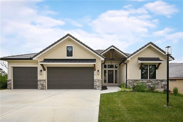 119 Teton Rdg, Lake Winnebago, MO 64034 - view of front facade featuring stone siding, stucco siding, and a garage