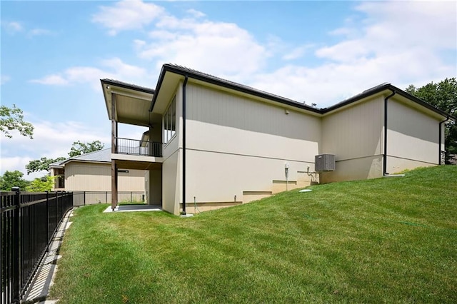119 Teton Rdg, Lake Winnebago, MO 64034 - back of house featuring a balcony