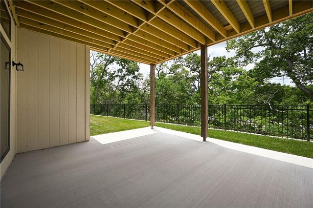 119 Teton Rdg, Lake Winnebago, MO 64034 - wooden deck featuring a patio and view of wooded area