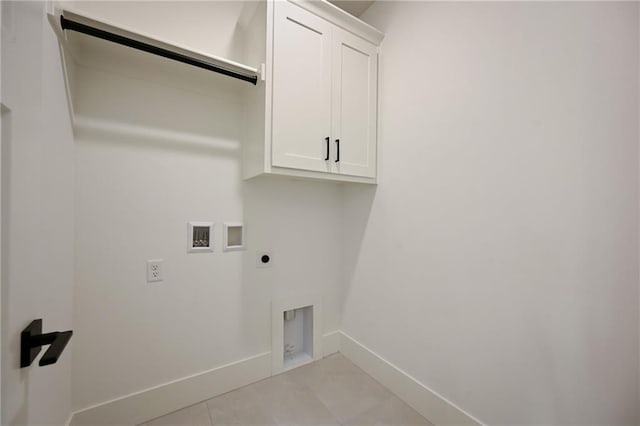 119 Teton Rdg, Lake Winnebago, MO 64034 - laundry room with electric dryer hookup, washer hookup, cabinet space, and light tile patterned flooring