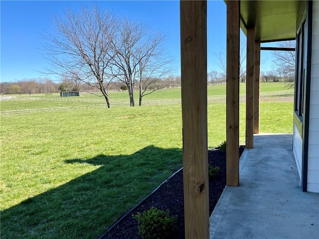 view of yard with a rural view