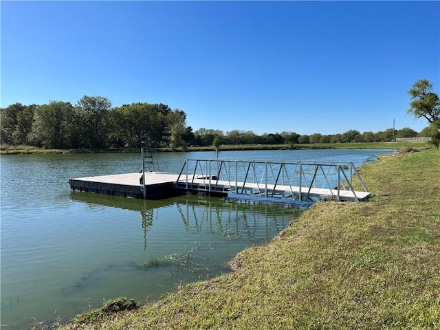 dock area featuring a water view and a yard