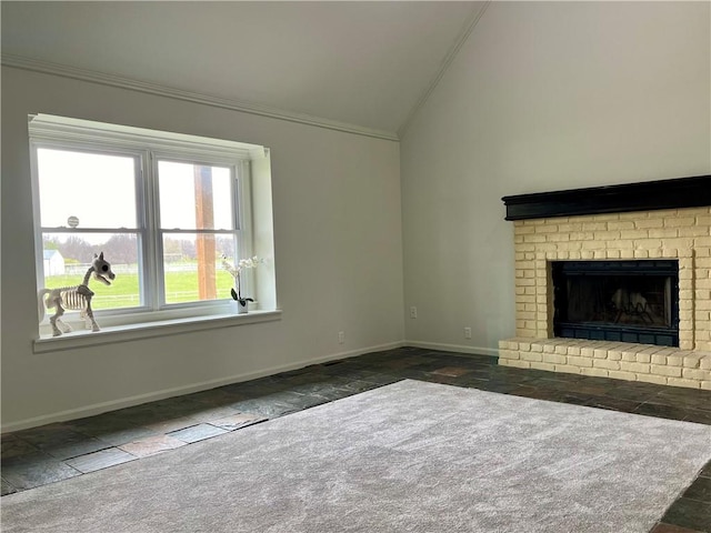 unfurnished living room featuring dark carpet, crown molding, lofted ceiling, and a fireplace