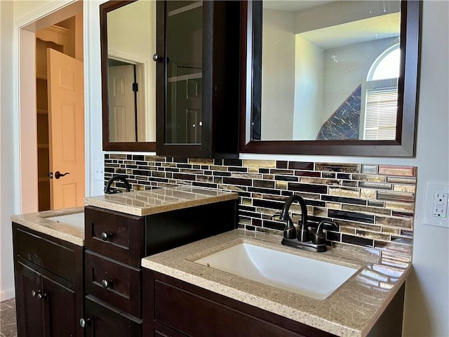 bathroom with backsplash and vanity