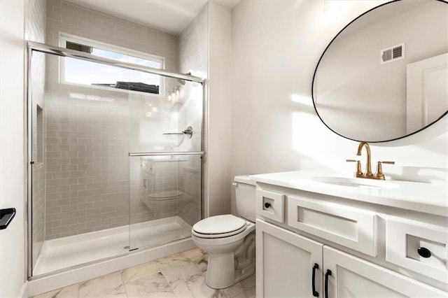 bathroom featuring a shower with door, toilet, tile floors, and vanity