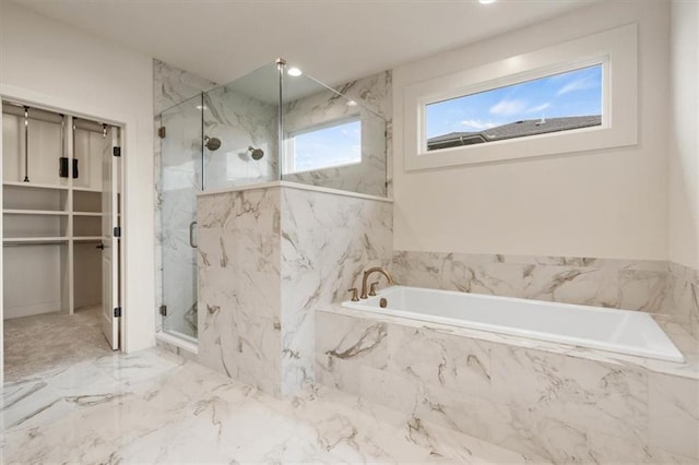 bathroom featuring tile flooring and shower with separate bathtub