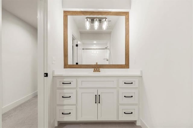 bathroom featuring vanity and tile floors