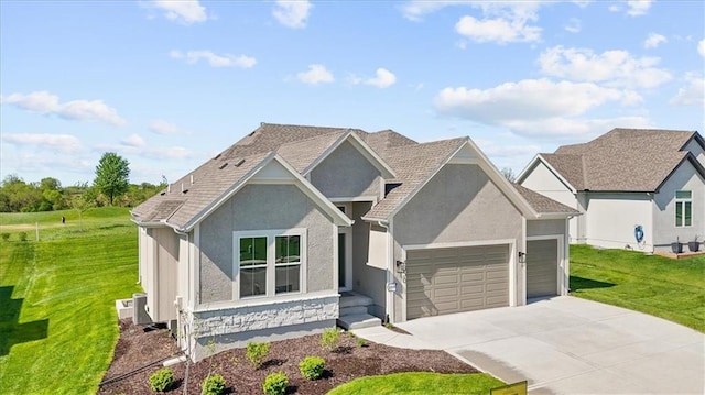 view of front of home featuring a garage and a front yard