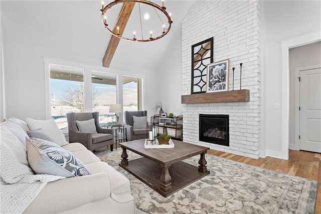20132 Barker St, Spring Hill, KS 66083 - living room featuring high vaulted ceiling, a fireplace, a chandelier, wood finished floors, and beamed ceiling