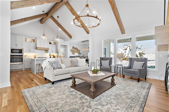 20132 Barker St, Spring Hill, KS 66083 - living room featuring a chandelier, beamed ceiling, high vaulted ceiling, light wood-style floors, and recessed lighting