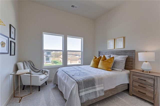 bedroom featuring light colored carpet