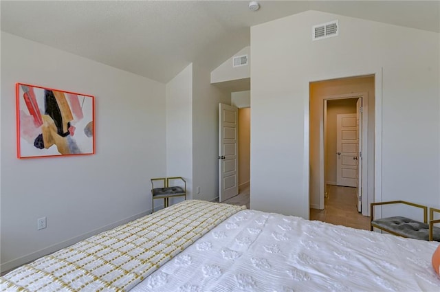 bedroom featuring vaulted ceiling