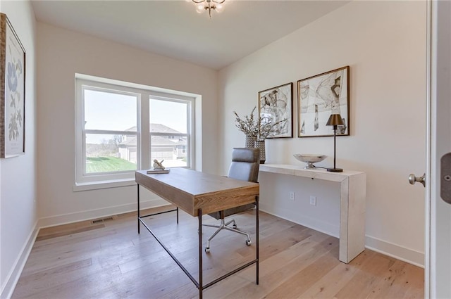 office area with light hardwood / wood-style flooring