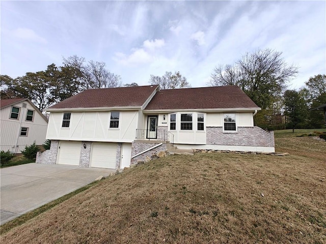 view of front facade with a garage and a front lawn