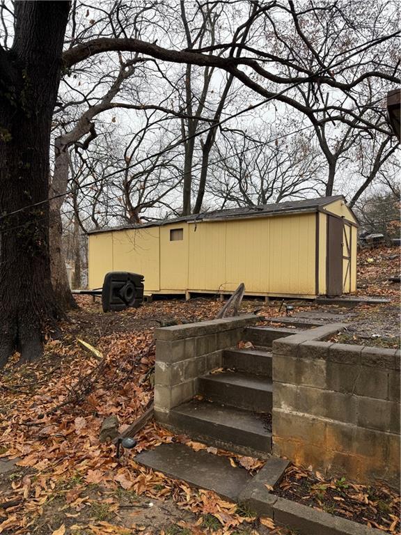 exterior space featuring a shed