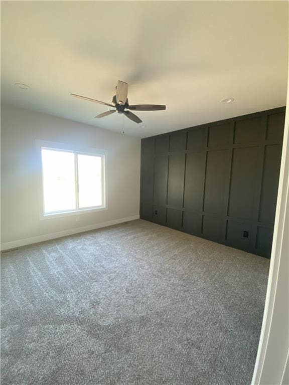 unfurnished bedroom with carpet and ceiling fan