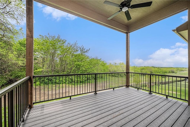 wooden deck featuring a ceiling fan