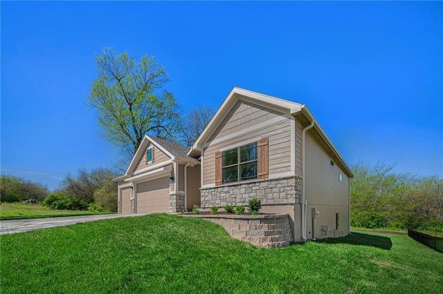 view of front of property with stone siding, concrete driveway, an attached garage, and a front lawn