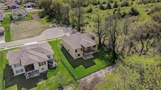 birds eye view of property with a residential view