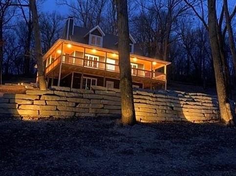 view of back house at night