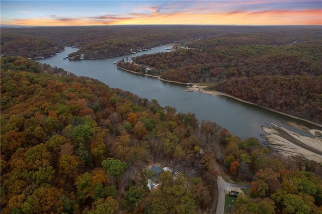 aerial view at dusk with a water view