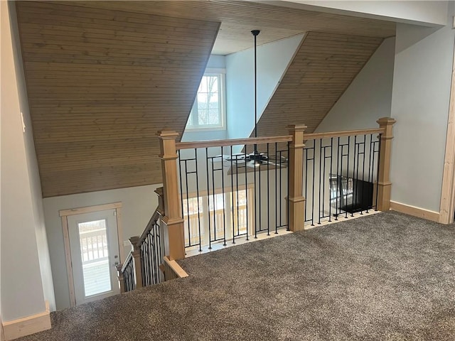 bonus room with carpet floors and lofted ceiling