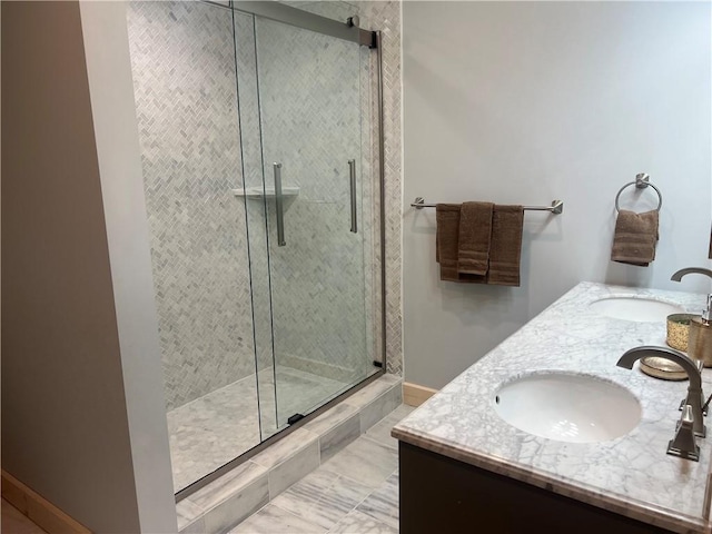 bathroom featuring dual vanity, an enclosed shower, and tile floors