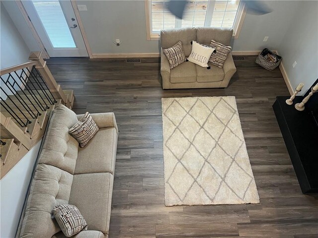 living room featuring dark wood-type flooring