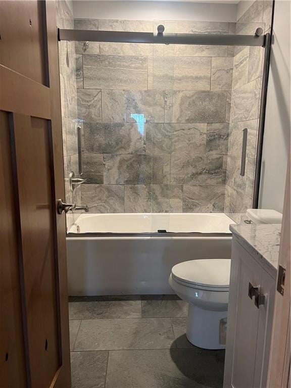 full bathroom with shower / bath combination with glass door, vanity, toilet, and tile floors