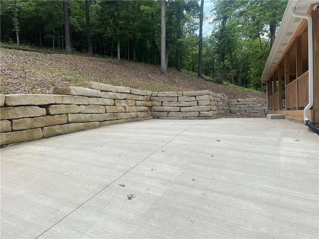 7930 Eagle Bay Dr, Gravois Mills, MO 65037 - view of patio featuring a wooded view