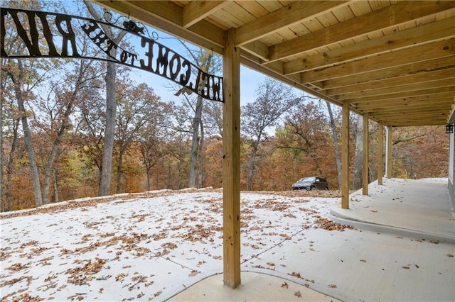 7930 Eagle Bay Dr, Gravois Mills, MO 65037 - snow covered patio featuring a wooded view