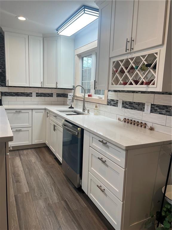 7930 Eagle Bay Dr, Gravois Mills, MO 65037 - kitchen with decorative backsplash, dishwasher, a sink, and dark wood-style floors
