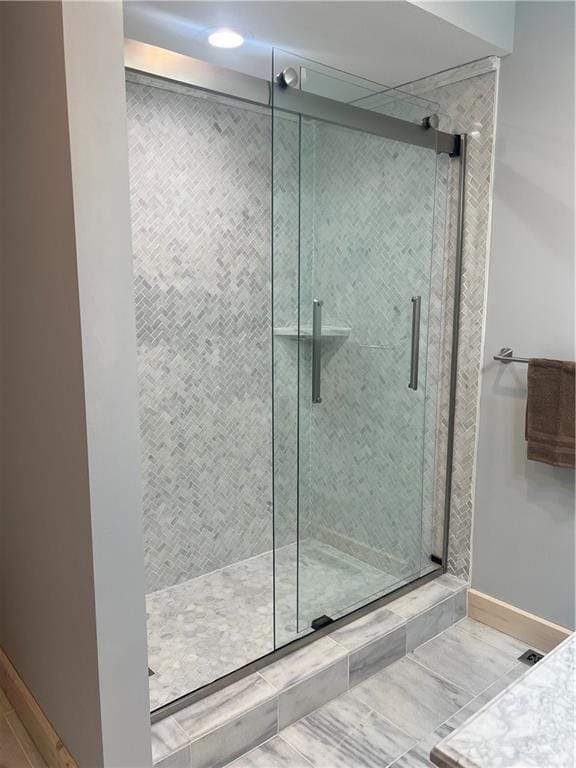 7930 Eagle Bay Dr, Gravois Mills, MO 65037 - bathroom featuring a shower stall and baseboards