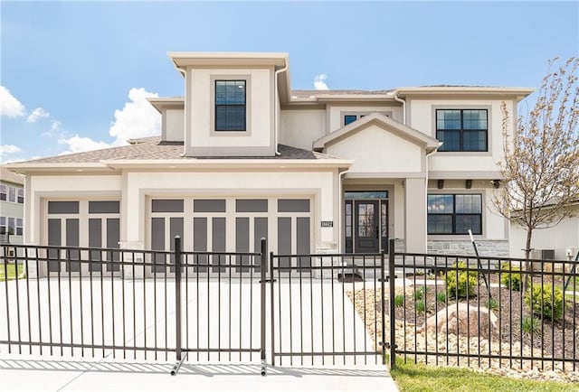 prairie-style house featuring fence private yard, stucco siding, and driveway