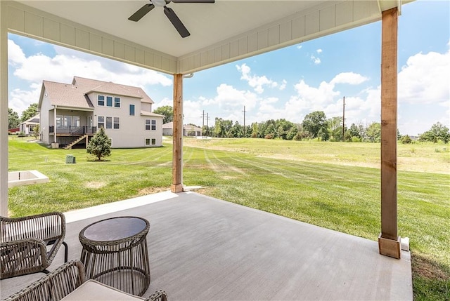 view of patio / terrace with a wooden deck and ceiling fan