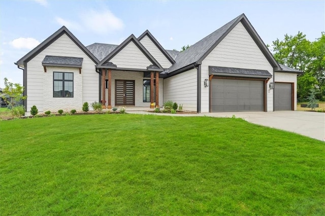 modern farmhouse style home featuring a garage, driveway, and a front yard