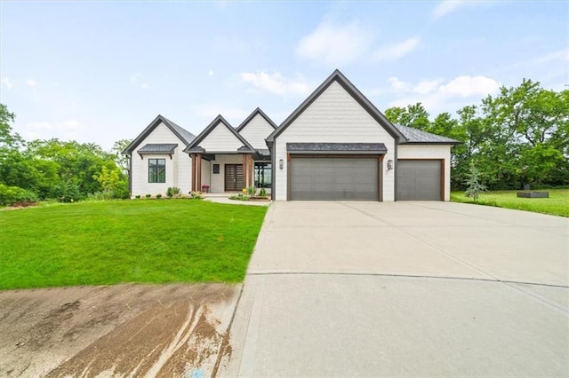 modern farmhouse style home with a garage, driveway, and a front yard