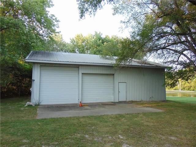 garage featuring a yard