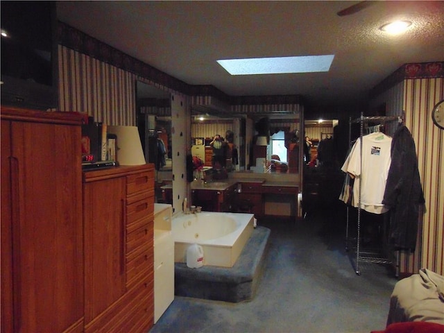 bathroom featuring a skylight