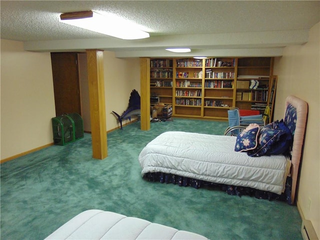 bedroom featuring carpet and a textured ceiling