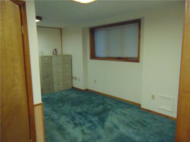 unfurnished bedroom featuring dark carpet