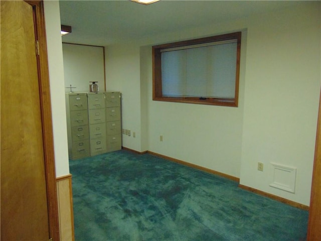 unfurnished bedroom featuring dark colored carpet