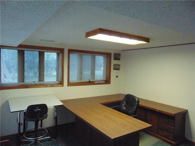 office area with a textured ceiling