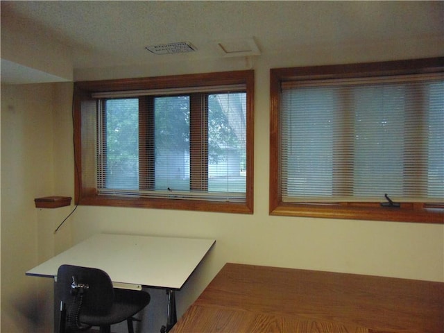 office space with a textured ceiling