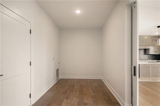 7551 NW Gower Ave, Kansas City, MO 64151 - hall featuring recessed lighting, hardwood / wood-style flooring, and baseboards