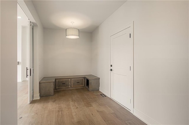 7551 NW Gower Ave, Kansas City, MO 64151 - interior space featuring baseboards and light wood-type flooring