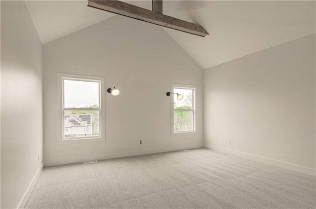 7551 NW Gower Ave, Kansas City, MO 64151 - carpeted spare room with high vaulted ceiling, beamed ceiling, and baseboards