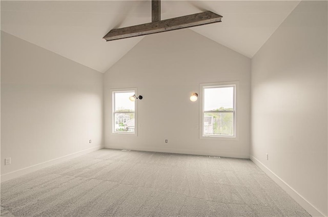 7551 NW Gower Ave, Kansas City, MO 64151 - carpeted spare room with beam ceiling, high vaulted ceiling, and baseboards