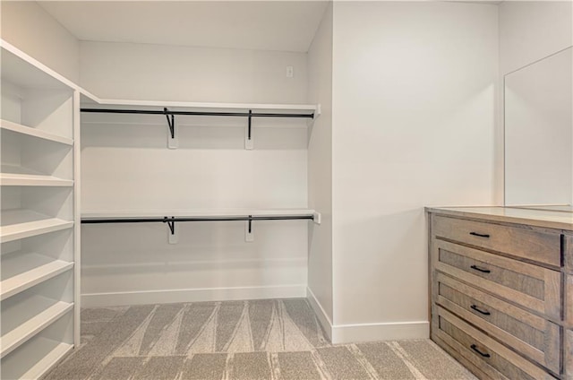 7551 NW Gower Ave, Kansas City, MO 64151 - walk in closet featuring carpet floors