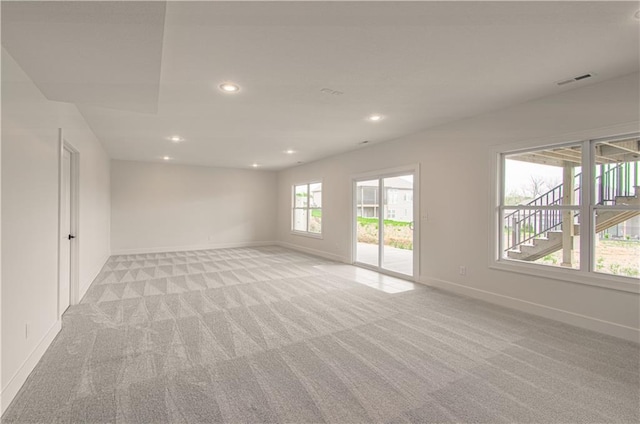 7551 NW Gower Ave, Kansas City, MO 64151 - empty room featuring baseboards, recessed lighting, and light carpet